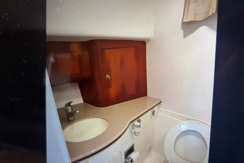 Slide: The Image of Bathroom interior of 2006 Intrepid 377 Walkaround with sink, cabinet, and toilet. - 24