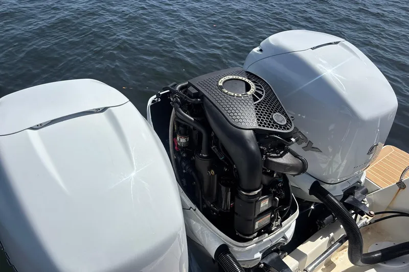 Slide: The Image of 2006 Intrepid 377 Walkaround boat engines on water, showcasing powerful outboard motors. - 26