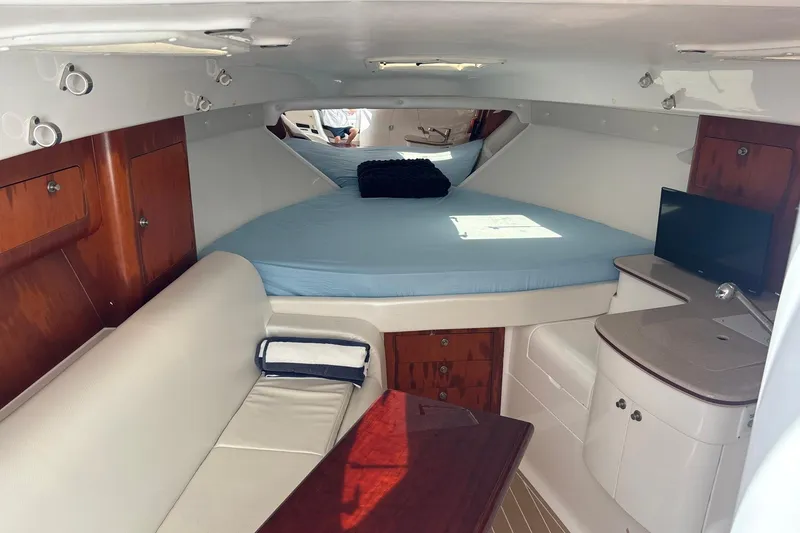 Slide: The Image of Interior of 2006 Intrepid 377 Walkaround boat with cozy cabin and modern amenities. - 21