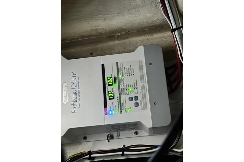 Slide: The Image of ProNautic 1250P marine battery charger installed on a 2006 Intrepid 377 Walkaround boat. - 29