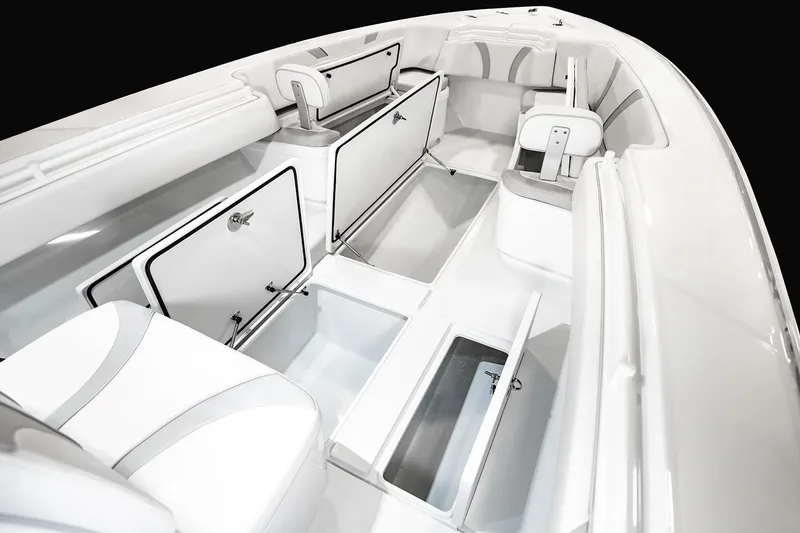 Slide: The Image of Manufacturer Provided Image: 2026 Contender 32 ST boat interior with open storage compartments and seating. - 4