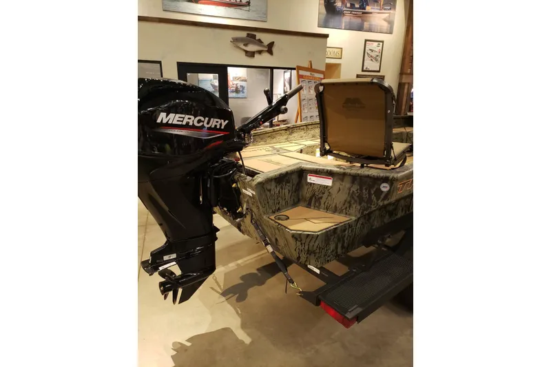 Slide: The Image of 2026 Tracker Grizzly 1756 T Marsh boat with Mercury outboard motor in showroom. - 4