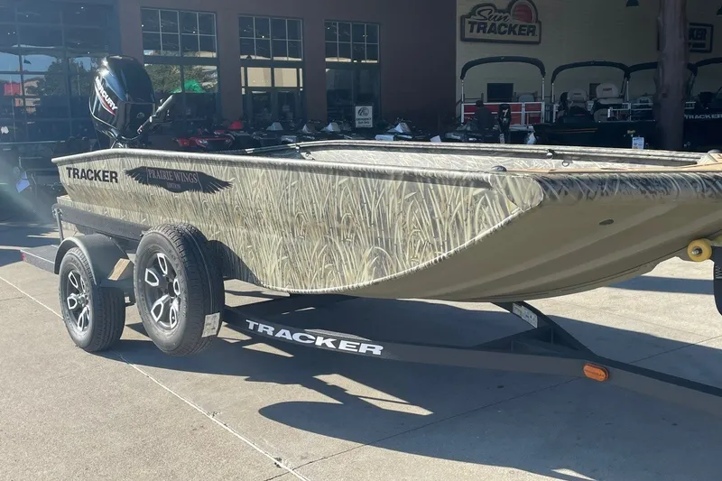 The Image of 2026 Tracker Grizzly 1650 T Prairie Wings Edition boat on trailer, outdoor display. - 0