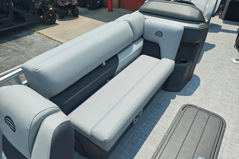 Slide: The Image of 2026 Sun Tracker Sportfish 24 XP3 boat interior with gray seating and storage compartment. - 5