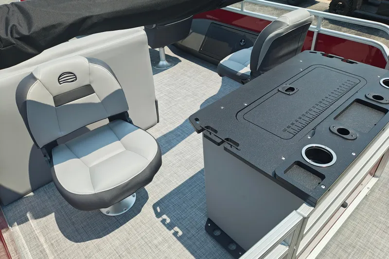 Slide: The Image of 2026 Sun Tracker Sportfish 24 XP3 interior with seating and fishing station. - 19