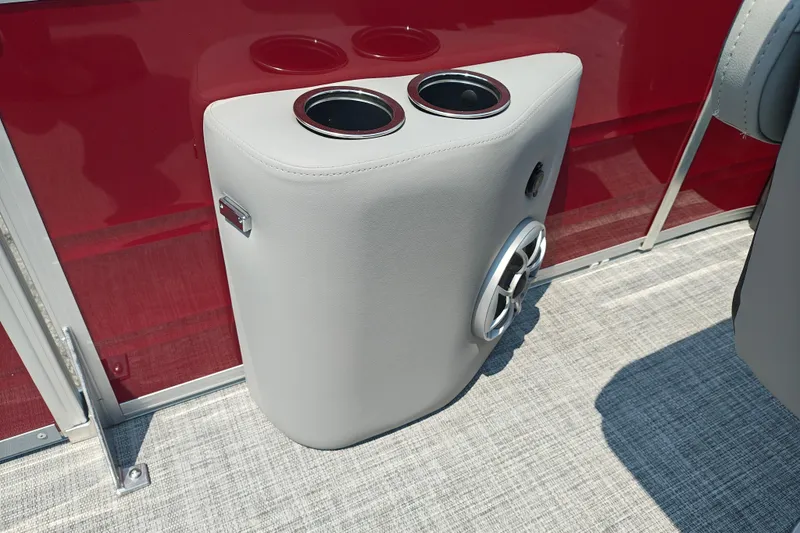 Slide: The Image of Cup holder and speaker on 2026 Sun Tracker Sportfish 24 XP3 boat interior. - 25