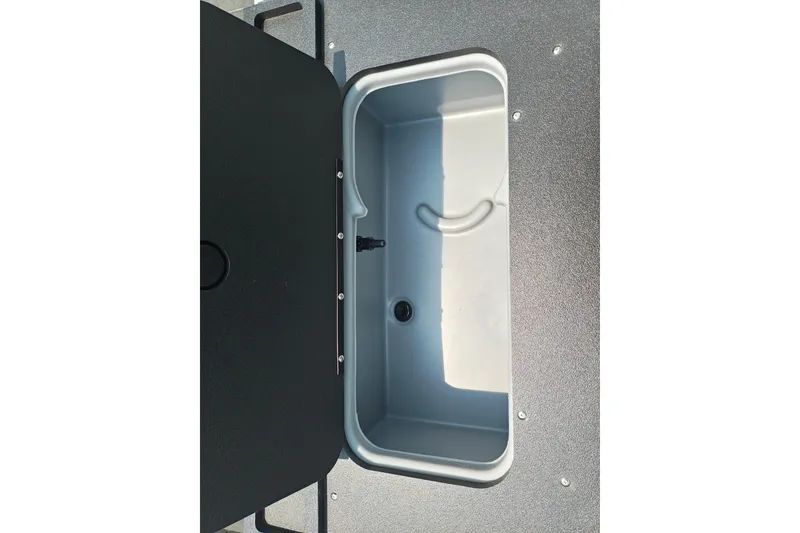 Slide: The Image of Livewell compartment on 2026 Sun Tracker Sportfish 24 XP3 boat, open lid view. - 17