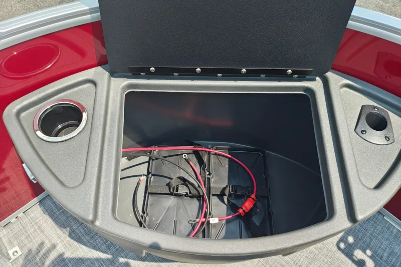 Slide: The Image of Storage compartment of 2026 Sun Tracker Sportfish 24 XP3 boat with cup holders. - 30