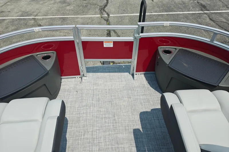 Slide: The Image of 2026 Sun Tracker Sportfish 24 XP3 boat interior with seating and cup holders. - 26
