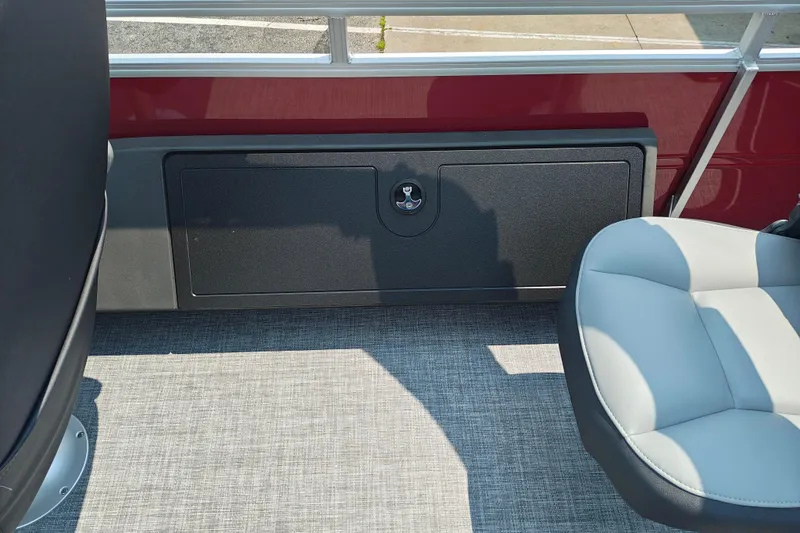 Slide: The Image of 2026 Sun Tracker Sportfish 24 XP3 interior with seating and storage compartment. - 16
