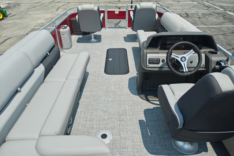 Slide: The Image of 2026 Sun Tracker Sportfish 24 XP3 pontoon boat interior with spacious seating and modern helm. - 22