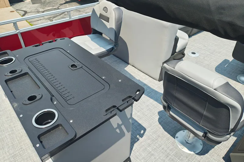 Slide: The Image of 2026 Sun Tracker Sportfish 24 XP3 interior with seating and fishing station. - 21
