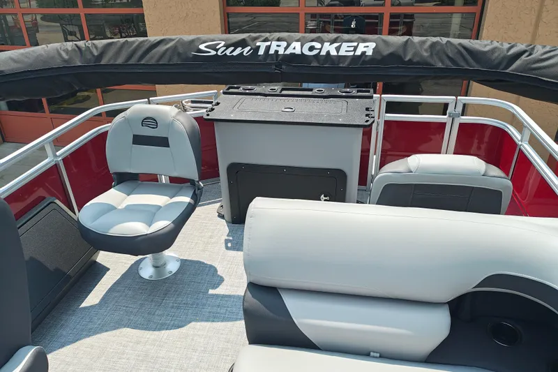 Slide: The Image of 2026 Sun Tracker Sportfish 24 XP3 interior with seating and helm station. - 15