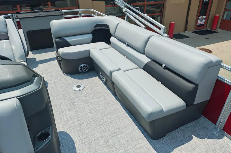 Slide: The Image of 2026 Sun Tracker Sportfish 24 XP3 pontoon boat interior with plush seating and modern design. - 6