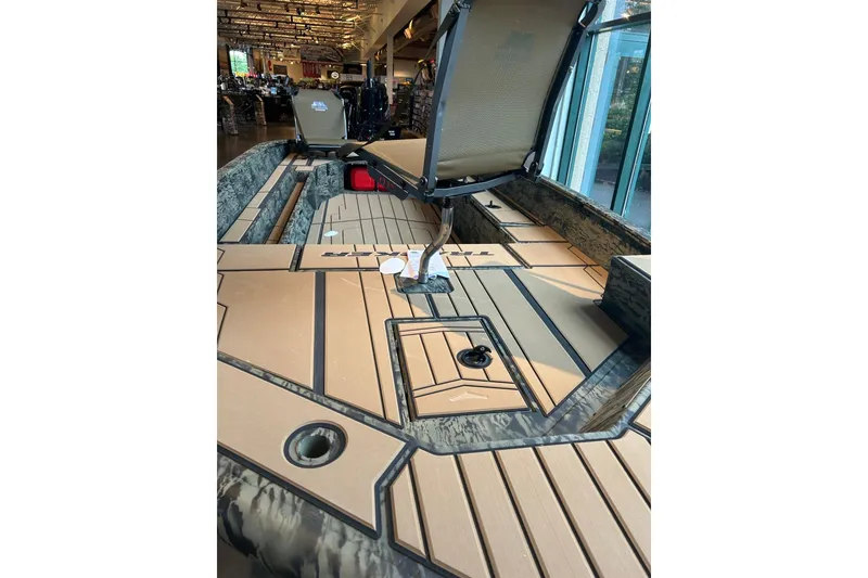 Slide: The Image of 2026 Tracker Grizzly 1756 T Marsh boat interior with open storage compartments. - 3