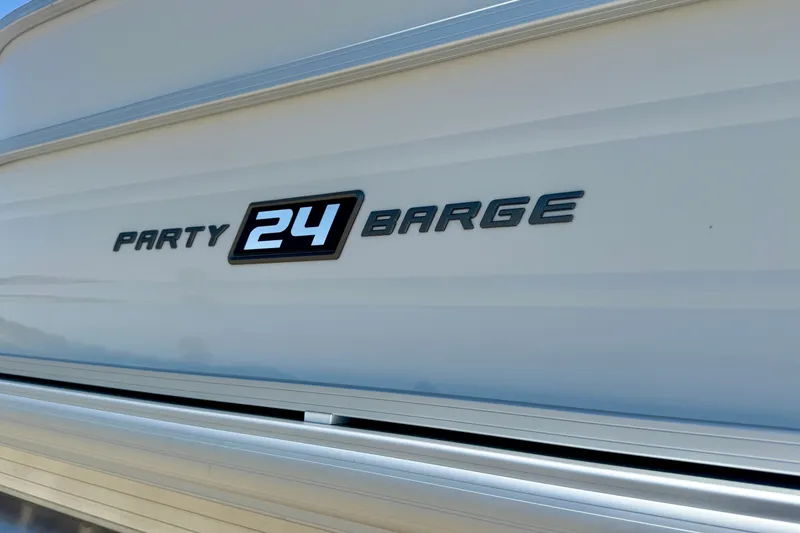 Slide: The Image of 2026 Sun Tracker Party Barge 24 XP3 logo on sleek white surface. - 12