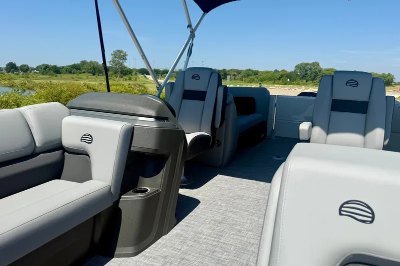 Slide: The Image of 2026 Sun Tracker Party Barge 24 XP3 interior with plush seating and modern design. - 7