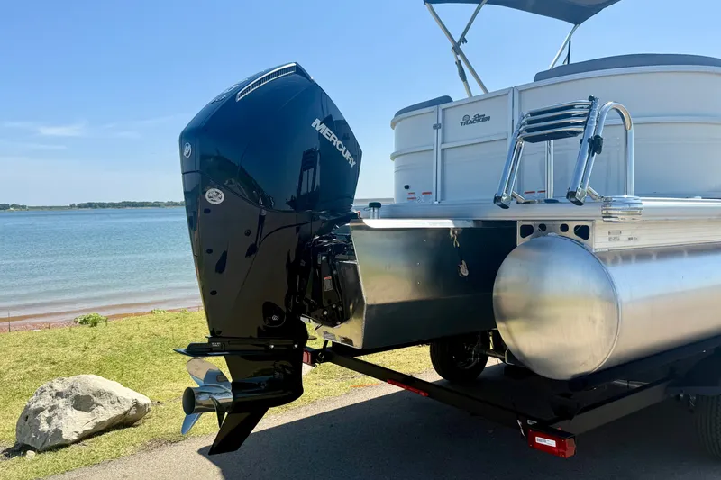 Slide: The Image of 2026 Sun Tracker Party Barge 24 XP3 pontoon boat with Mercury outboard motor by a lake. - 9