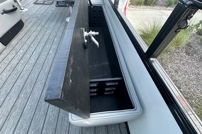 Slide: The Image of Open storage compartment on 2026 Ranger 223F boat with sleek interior design. - 85