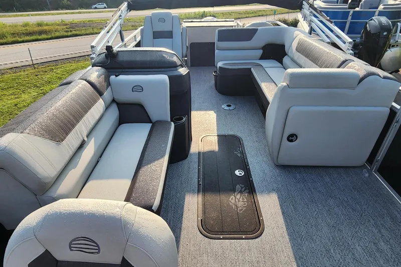 Slide: The Image of 2026 Sun Tracker Fishin' Barge 22 XP3 interior with spacious seating and modern design. - 5