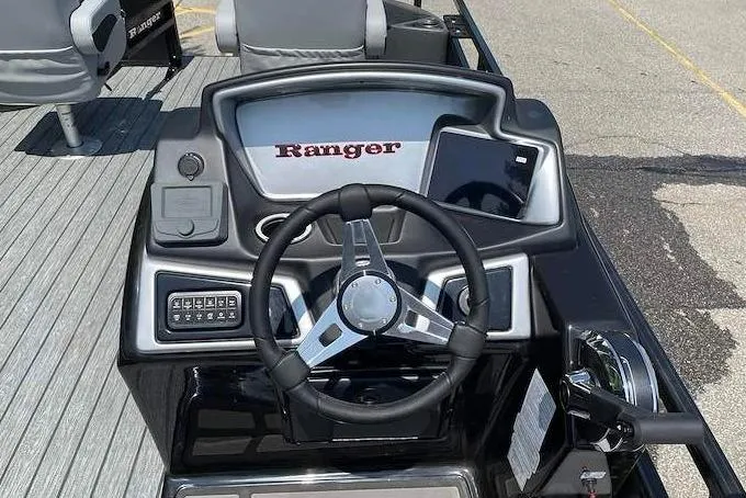 Slide: The Image of 2026 Ranger 220F boat dashboard with steering wheel and control panel. - 4