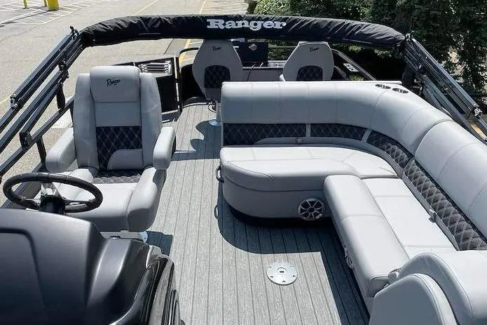 Slide: The Image of 2026 Ranger 220F boat interior with luxurious gray seating and modern design. - 6
