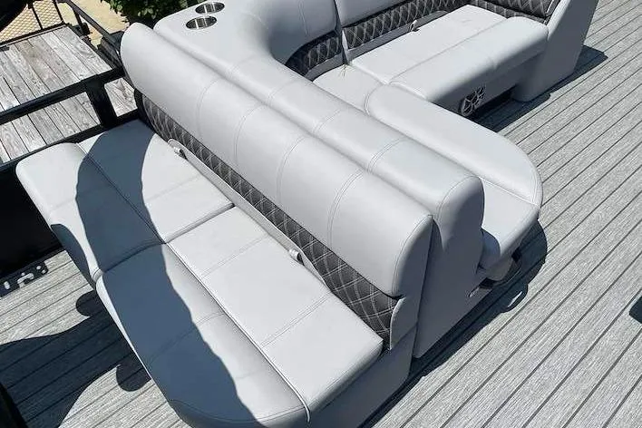 Slide: The Image of Luxurious seating on 2026 Ranger 220F boat with gray upholstery and cup holders. - 8