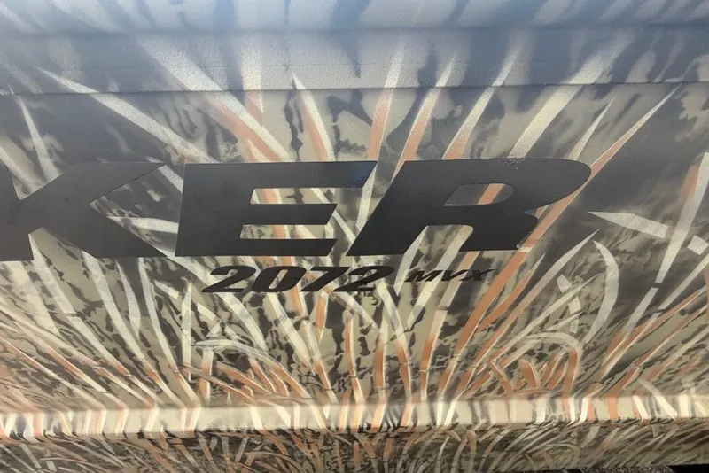 Slide: The Image of Camouflage design on 2026 Tracker Grizzly 2072 CC boat with bold lettering. - 8