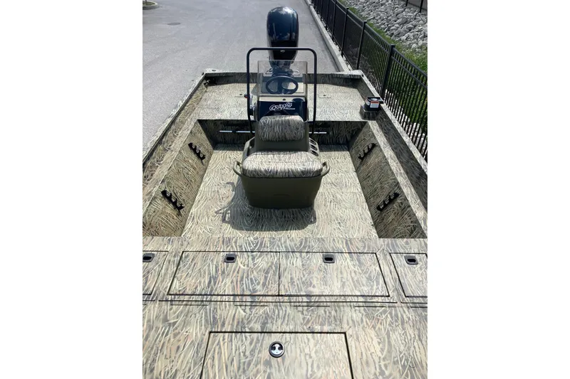 Slide: The Image of 2026 Tracker Grizzly 2072 CC boat with camouflage design and central console. - 13