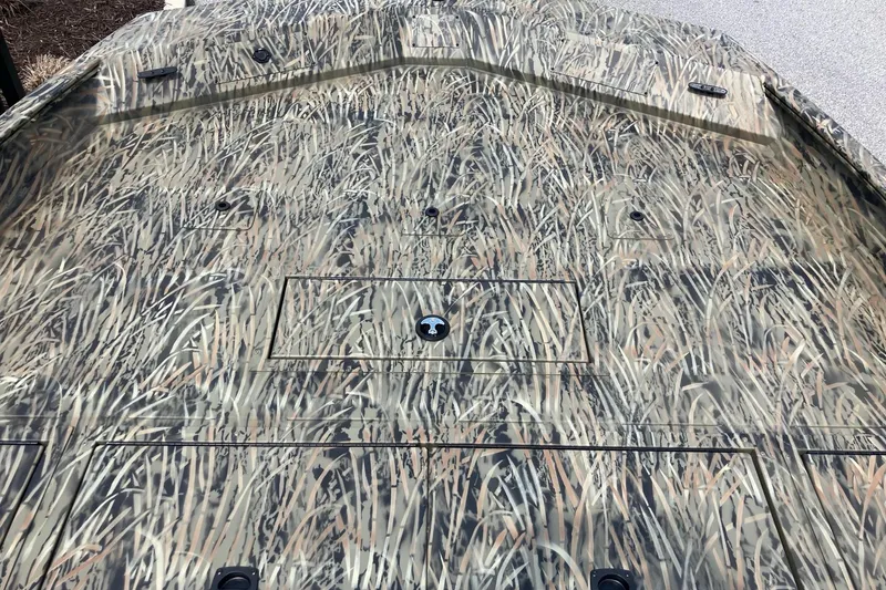 Slide: The Image of Camouflage-patterned deck of 2026 Tracker Grizzly 2072 CC boat. - 10