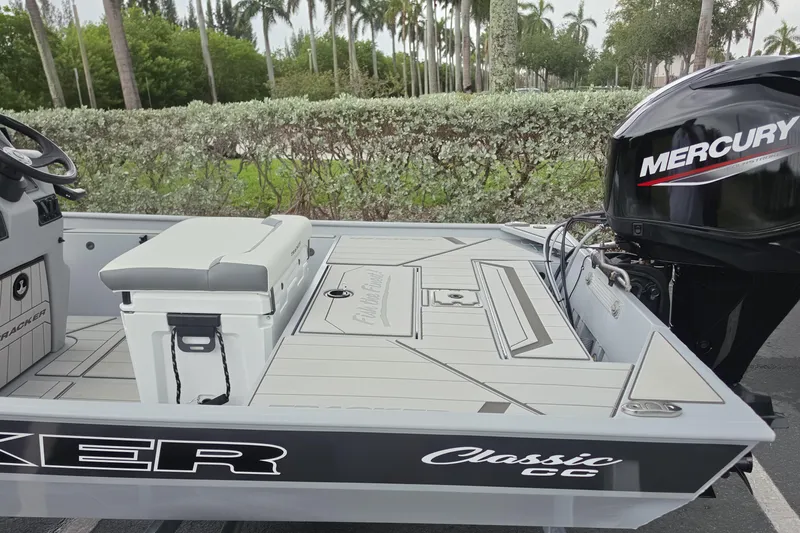 Slide: The Image of 2026 Tracker Bass Tracker Classic CC boat with Mercury engine, featuring sleek design and spacious deck. - 3