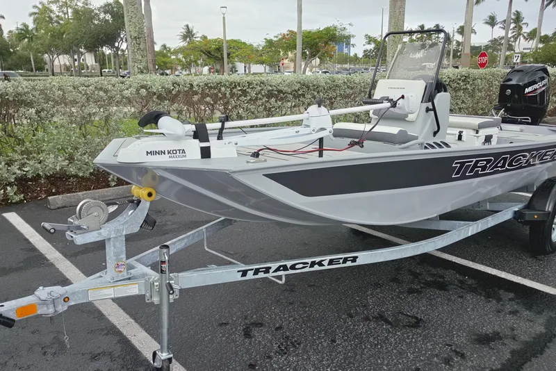 Slide: The Image of 2026 Tracker Bass Tracker Classic CC boat on trailer in parking lot. - 2