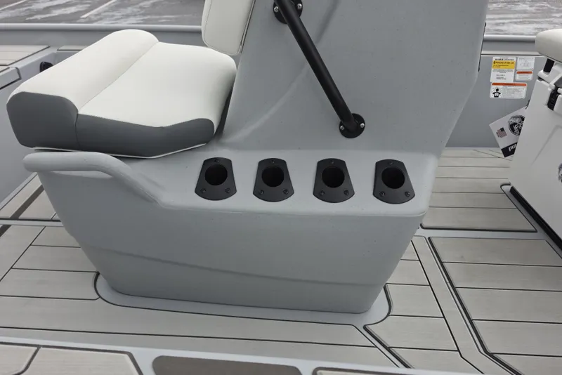 Slide: The Image of 2026 Tracker Bass Tracker Classic CC boat seat with rod holders on deck. - 9