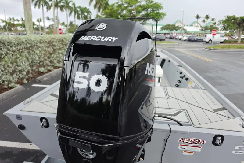 Slide: The Image of 2026 Tracker Bass Tracker Classic CC with Mercury 50 outboard motor in parking lot. - 49