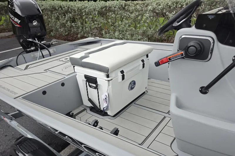 Slide: The Image of 2026 Tracker Bass Tracker Classic CC boat interior with cooler and Mercury engine. - 7