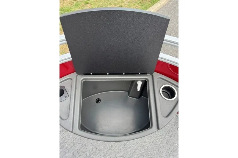 Slide: The Image of 2026 Sun Tracker Fishin' Barge 22 XP3 livewell with cup holder and lid open. - 19