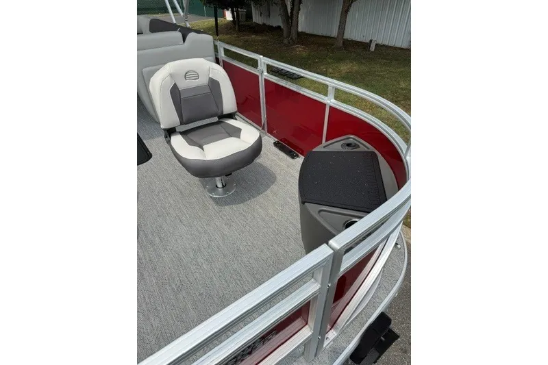 Slide: The Image of 2026 Sun Tracker Fishin' Barge 22 XP3 pontoon boat with seating and red railing. - 14