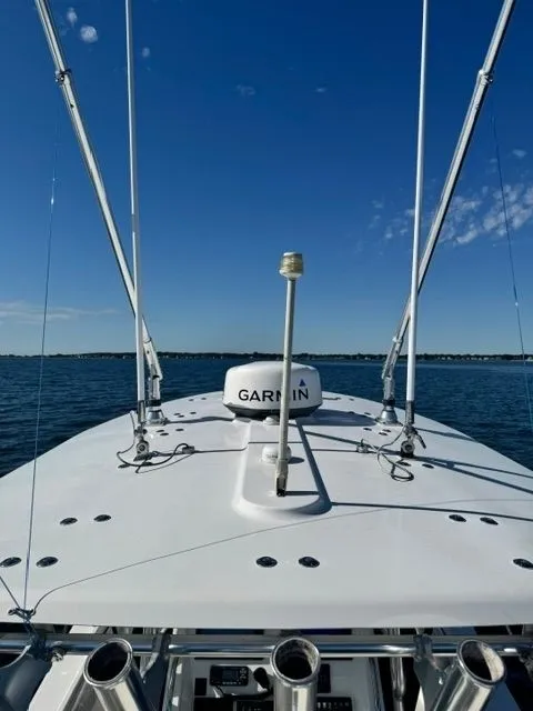 Slide: The Image of The image shows the deck of a 2015 Regulator 25 boat with Garmin equipment. - 17