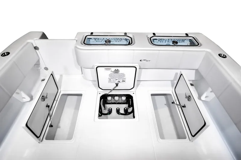 Slide: The Image of Manufacturer Provided Image: 2026 Contender 35 ST boat interior with open storage compartments and live wells. - 7