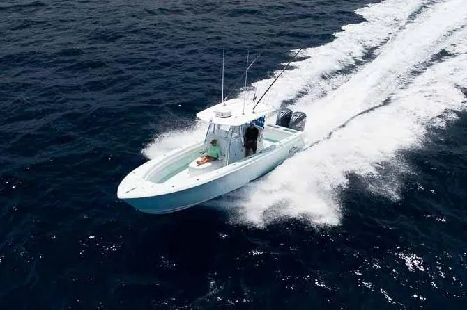 Slide: The Image of Manufacturer Provided Image: 2026 Contender 35 ST boat cruising on open water. - 2