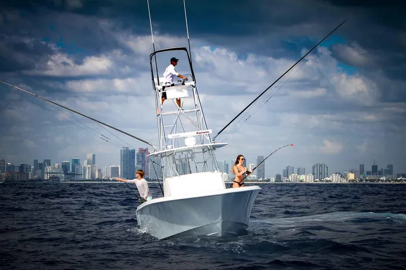 Slide: The Image of Manufacturer Provided Image: 2026 Contender 39 Fisharound boat on ocean near city skyline. - 3
