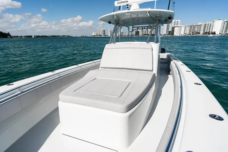 Slide: The Image of Manufacturer Provided Image: 2026 Contender 39 Fisharound boat on water, featuring spacious deck and modern design. - 5