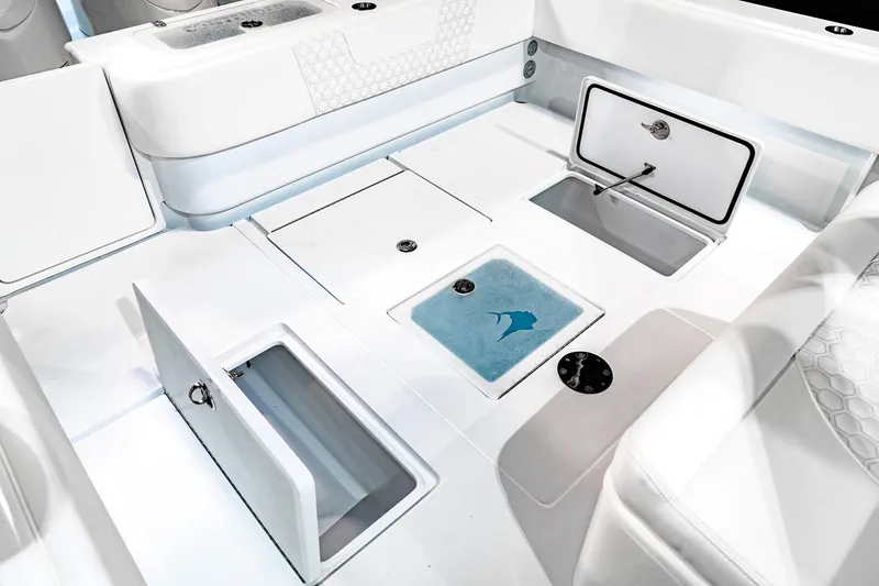 Slide: The Image of Manufacturer Provided Image: 2026 Contender 39 Fisharound boat interior with open storage compartments and seating. - 8