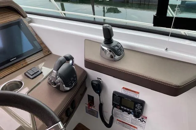 Slide: The Image of Control panel of 2018 Cruisers Yachts 45 Cantius with navigation and communication equipment. - 13