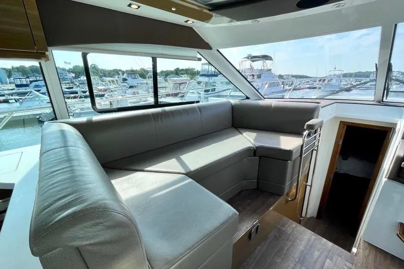 Slide: The Image of Luxurious interior of 2018 Cruisers Yachts 45 Cantius with marina view. - 8