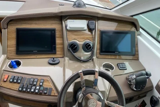 Slide: The Image of Helm of 2018 Cruisers Yachts 45 Cantius with dual screens and modern controls. - 12