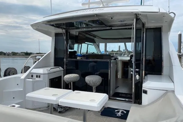 Slide: The Image of 2018 Cruisers Yachts 45 Cantius with open cockpit, modern seating, and sleek design. - 4