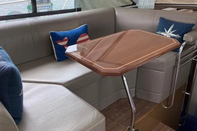 Slide: The Image of Luxurious interior of 2018 Cruisers Yachts 45 Cantius with elegant seating and table. - 11