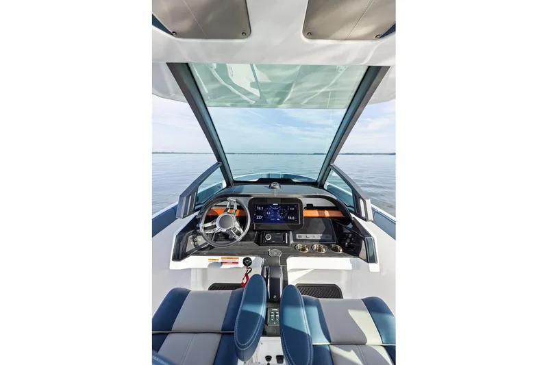 Slide: The Image of Cockpit view of 2027 Monterey Elite 25 OB boat with modern dashboard and steering. - 4