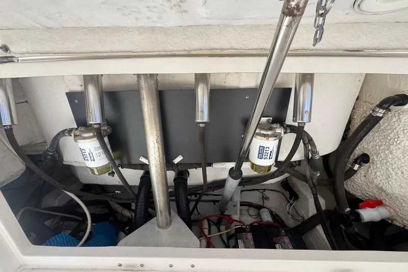 Slide: The Image of Engine compartment of a 2017 Sailfish 325 DC boat, showing fuel filters and hoses. - 20
